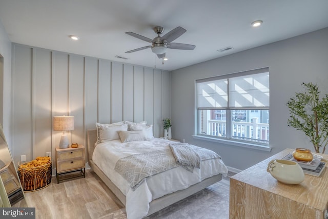 bedroom with ceiling fan and light wood-type flooring