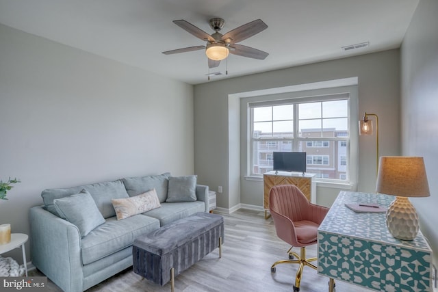 office featuring ceiling fan and light hardwood / wood-style flooring