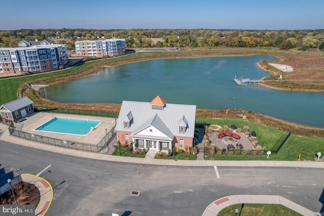 birds eye view of property featuring a water view