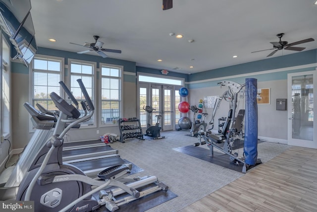 exercise room featuring light hardwood / wood-style flooring, plenty of natural light, french doors, and ceiling fan