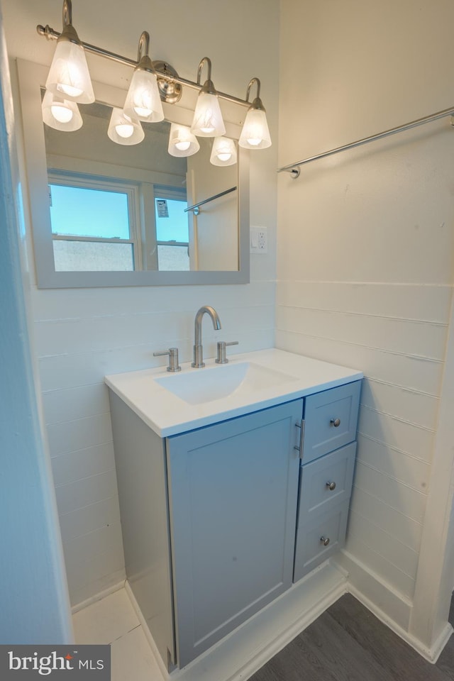 bathroom with vanity and wood-type flooring