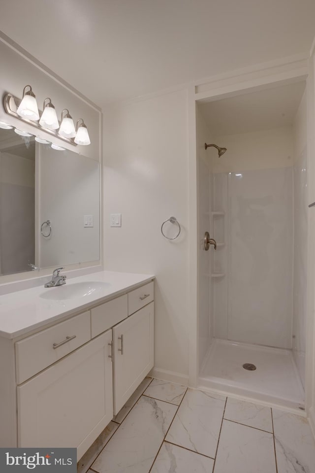 bathroom featuring vanity and a shower