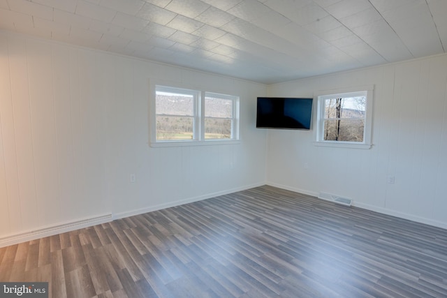 empty room featuring dark hardwood / wood-style floors