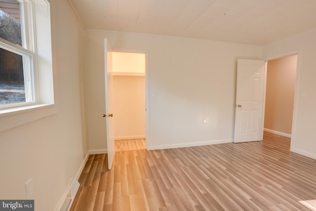 spare room featuring light hardwood / wood-style floors