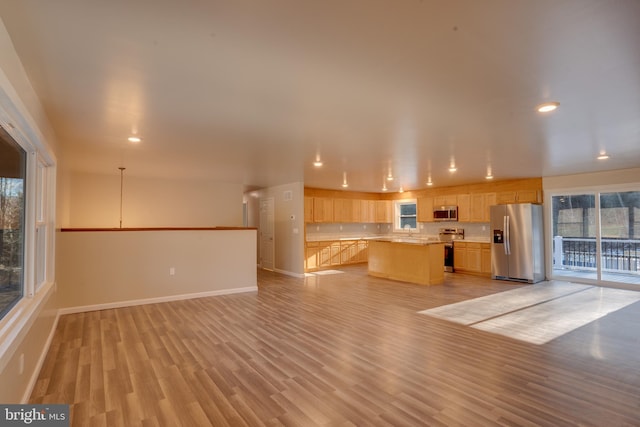 unfurnished living room featuring light hardwood / wood-style flooring