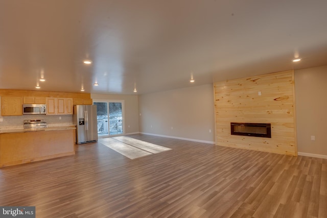 unfurnished living room with light hardwood / wood-style flooring