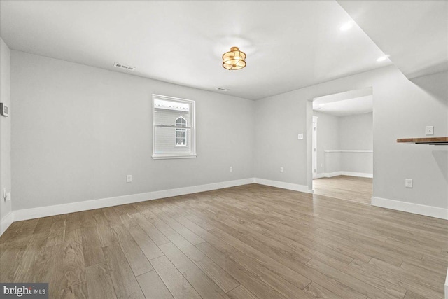 spare room featuring light hardwood / wood-style floors