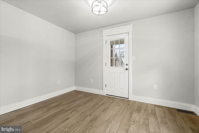 unfurnished room featuring wood-type flooring