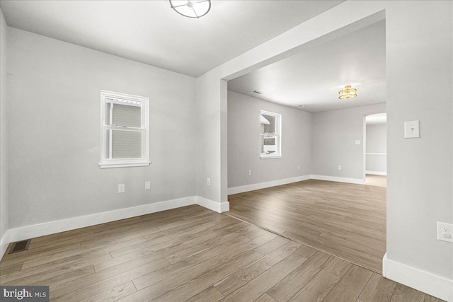 unfurnished room featuring wood-type flooring