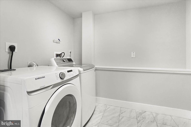 laundry room featuring separate washer and dryer