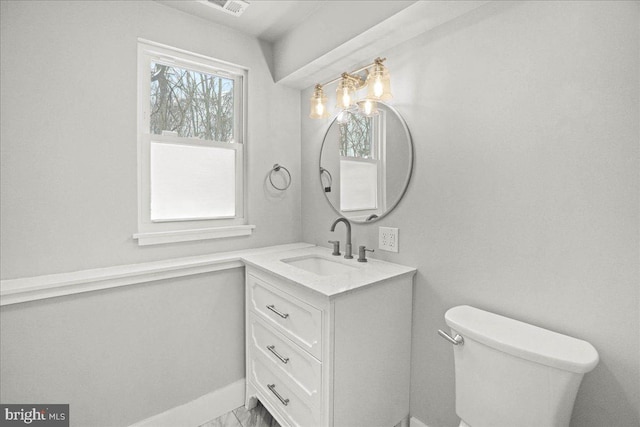 bathroom with vanity and toilet