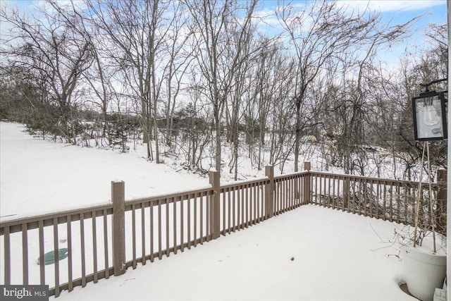 view of snow covered deck