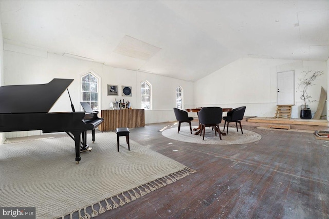 interior space featuring lofted ceiling and hardwood / wood-style flooring