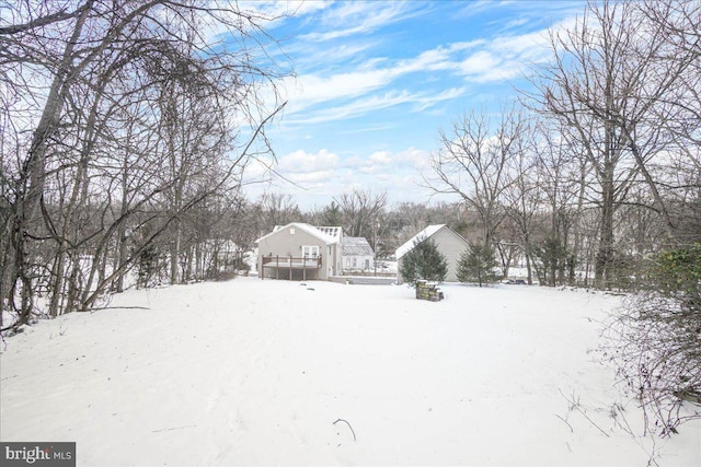 view of yard layered in snow