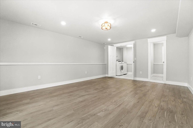 interior space with light hardwood / wood-style floors and independent washer and dryer