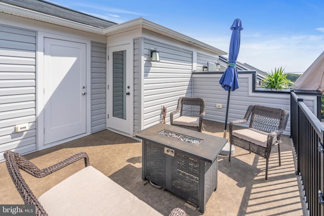 view of patio / terrace with a fire pit