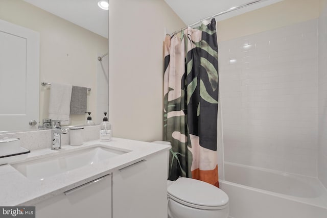 full bathroom with vanity, toilet, and shower / tub combo with curtain