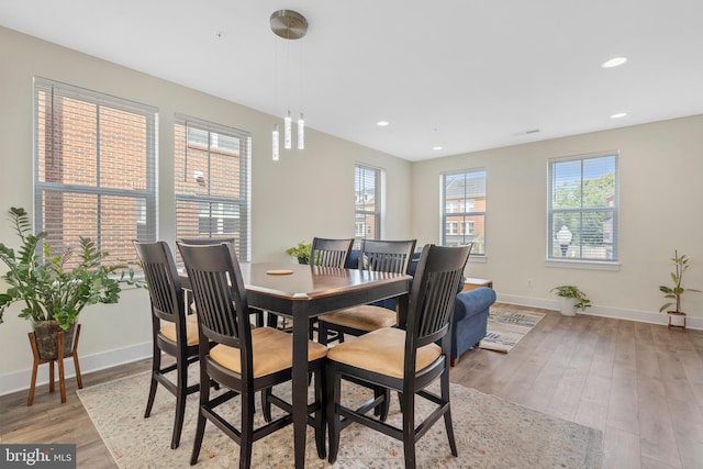 dining area featuring light wood-type flooring