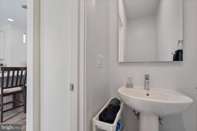 bathroom featuring hardwood / wood-style flooring and sink