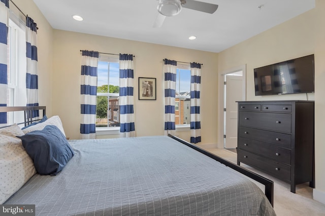 carpeted bedroom featuring ceiling fan