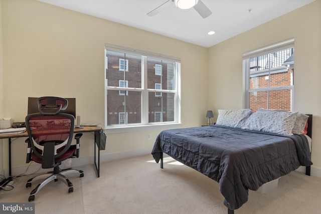 bedroom featuring light carpet and ceiling fan