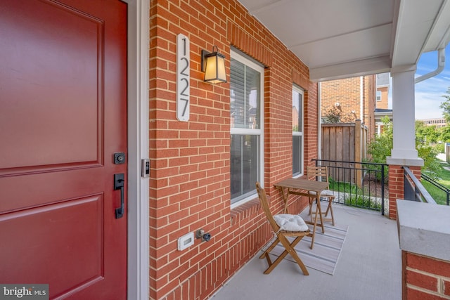 view of exterior entry with covered porch