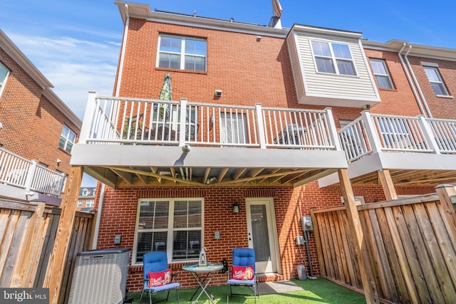 back of house with a balcony