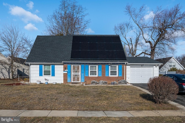 new england style home with a garage and a front yard