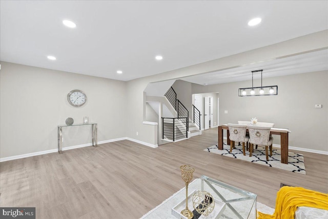 living room with light hardwood / wood-style floors