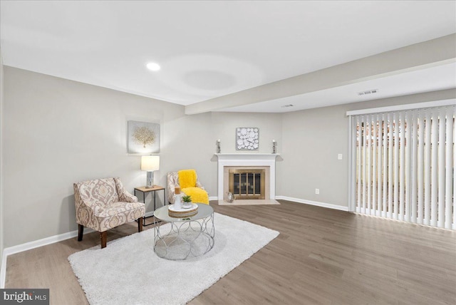 sitting room with hardwood / wood-style floors