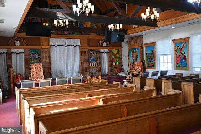 interior space featuring carpet and a chandelier