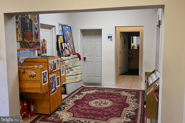 corridor featuring light tile patterned floors