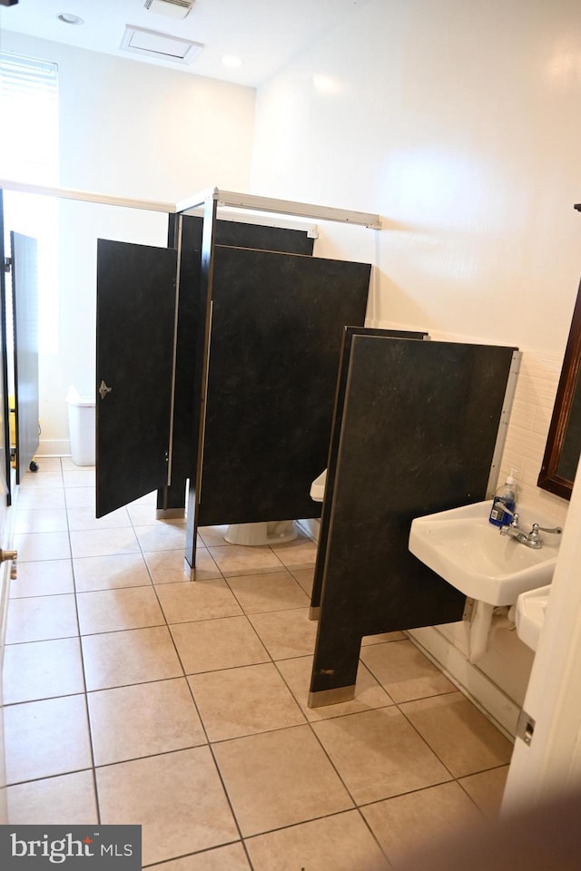 bathroom with sink and tile patterned flooring