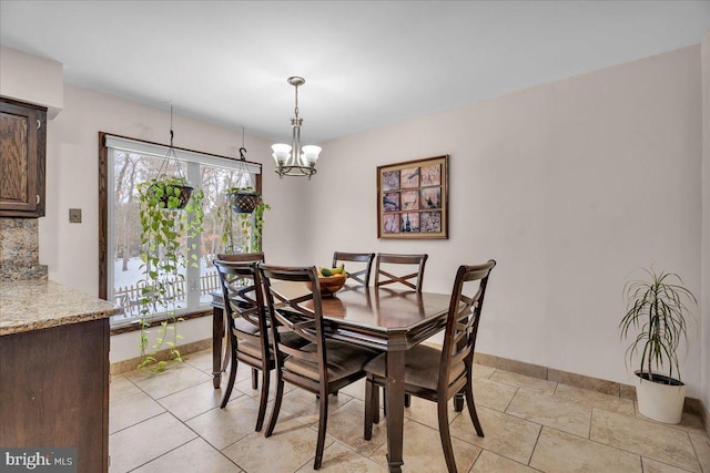 dining space with an inviting chandelier