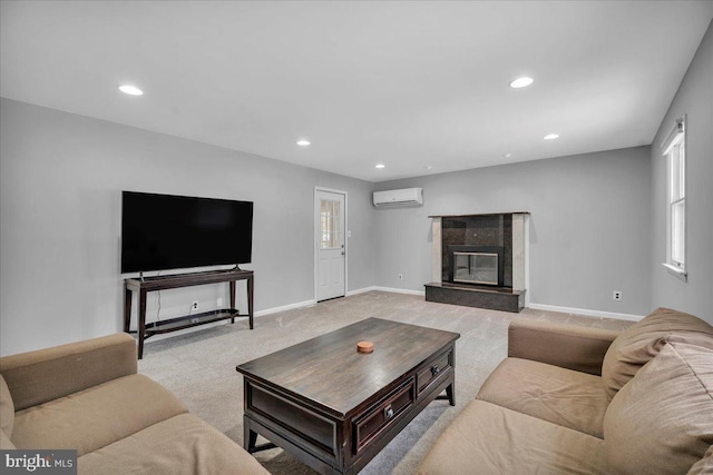 carpeted living room with a premium fireplace and a wall mounted air conditioner