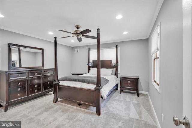 carpeted bedroom featuring ceiling fan and ornamental molding