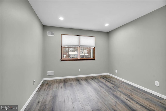 unfurnished room featuring wood-type flooring