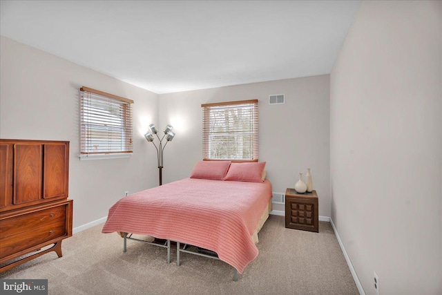 bedroom featuring light colored carpet