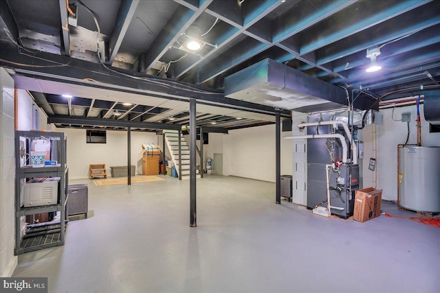 basement featuring heating unit and gas water heater