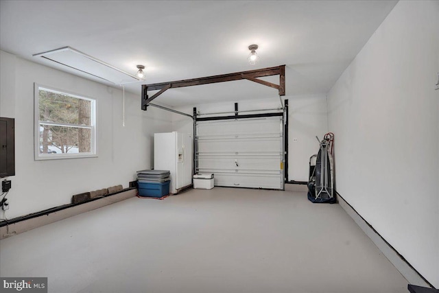 garage featuring white fridge with ice dispenser