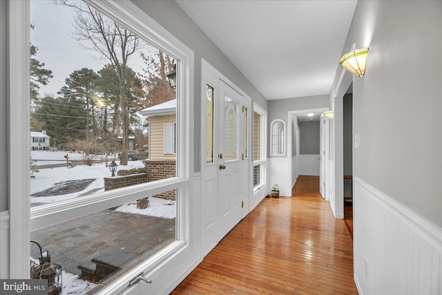 hall with light hardwood / wood-style flooring