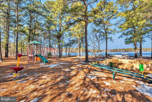 view of jungle gym featuring a water view