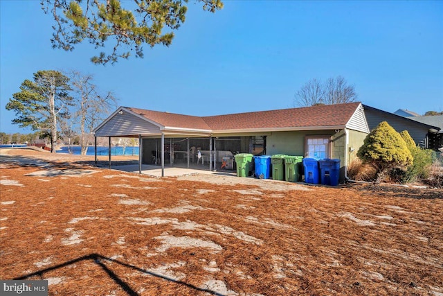 back of property with a patio