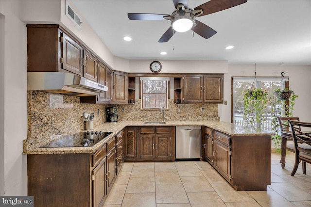 kitchen with sink, stainless steel dishwasher, kitchen peninsula, black electric stovetop, and light stone countertops