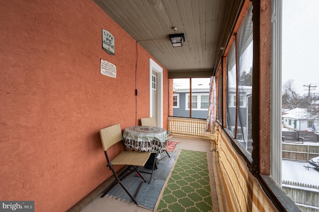 sunroom featuring wood ceiling