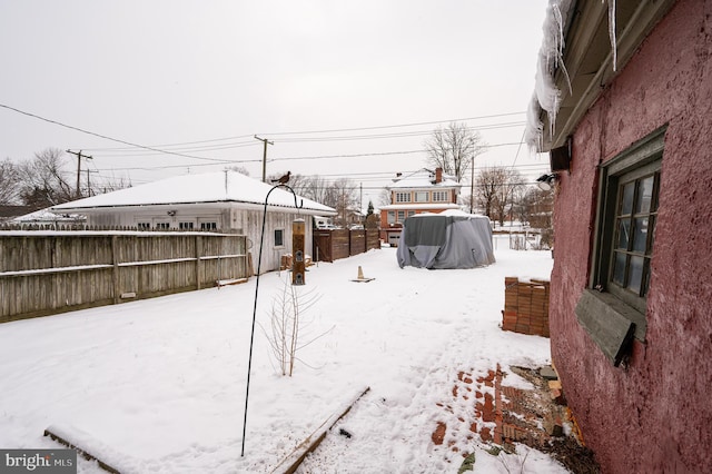 view of yard layered in snow