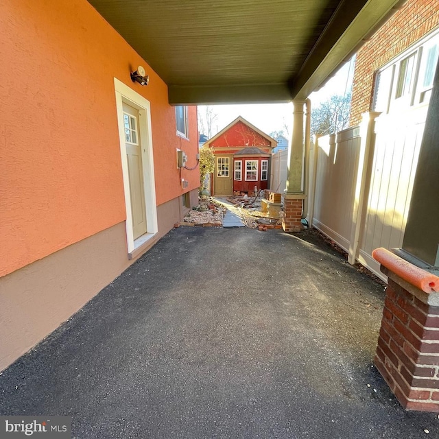 view of patio / terrace with an outbuilding