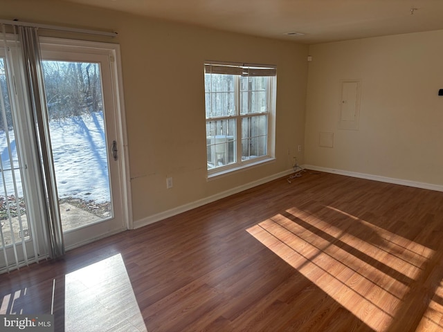 unfurnished room with wood-type flooring