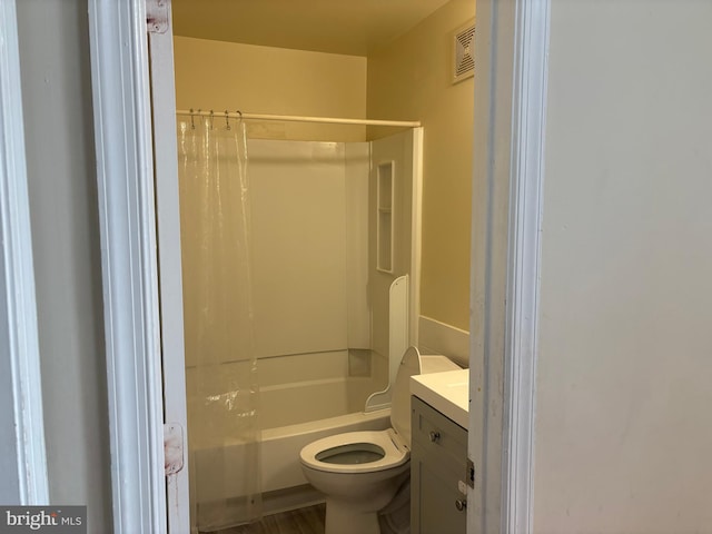 full bathroom featuring vanity, bathing tub / shower combination, and toilet