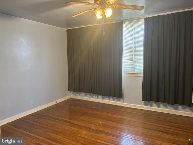 empty room featuring ceiling fan and wood-type flooring